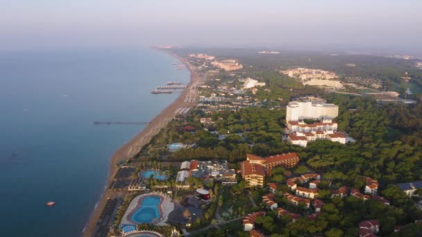 Drone view of sea and hotels on coastline. — Stock Video