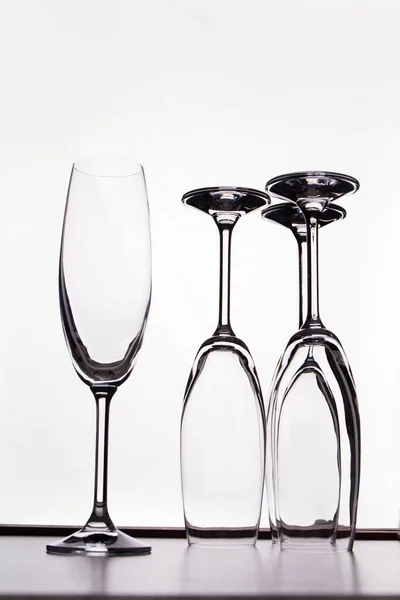 Several glass champagne cups on a white background. — Stock Photo, Image