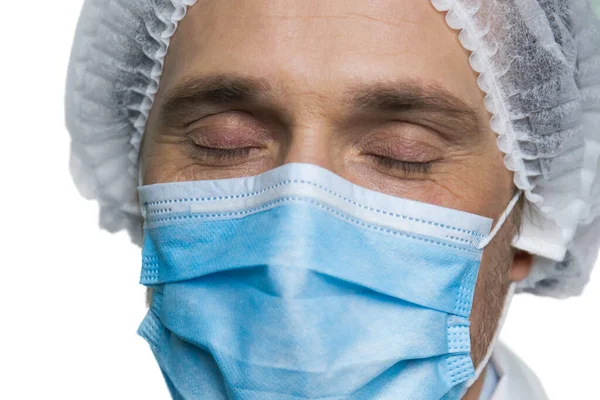 Portrait of doctors face with closing eyes.