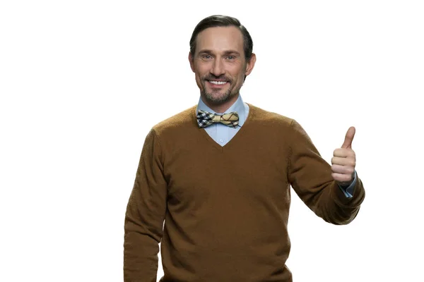 Positive middle-aged man in browm sweater with bowtie. — Stock Photo, Image