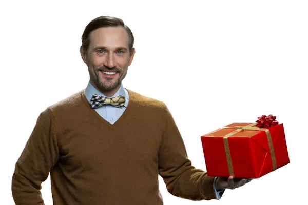 Positive middle-aged man with red presents box. — Stock Photo, Image