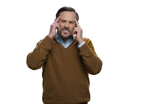 Middle-aged european man has a headache. — Stock Photo, Image