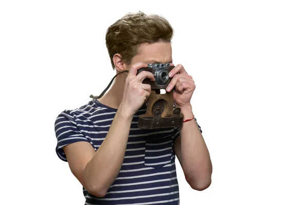 Boy taking a photo using retro vintage photo camera. — Stock Photo, Image