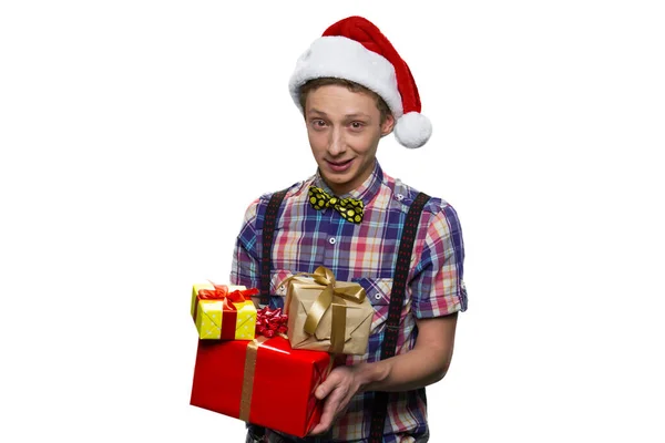 Teenage boy with gift boxes for christmas. — Stock Photo, Image