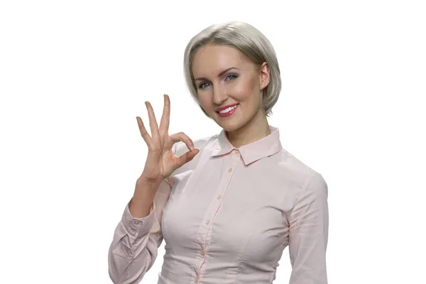 Mature blond woman is showing ok gesture. — Stock Photo, Image