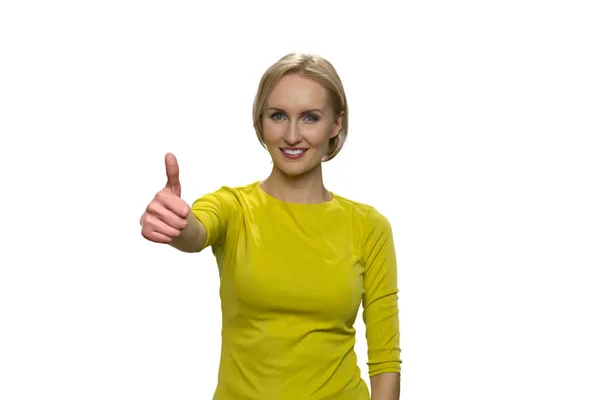 Smiling woman giving thumbs up on white background. — Stock Photo, Image