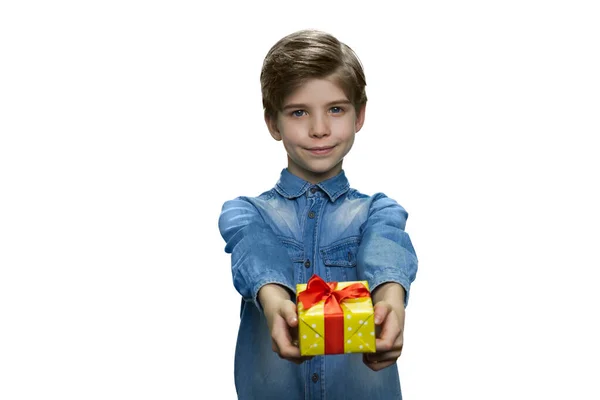 Smiling boy is giving small gift box. — Stock Photo, Image