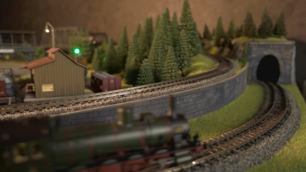 Passenger trains on miniature railway train station model. — Stock Video