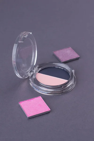 Close-up cosmetic powder boxes.