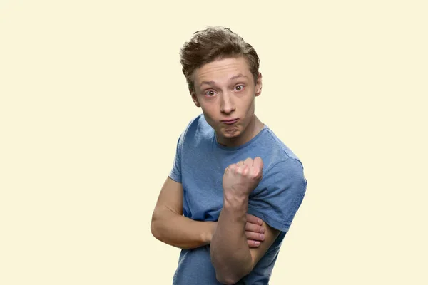 Irritated menacing teen boy on white background. — Stock Photo, Image