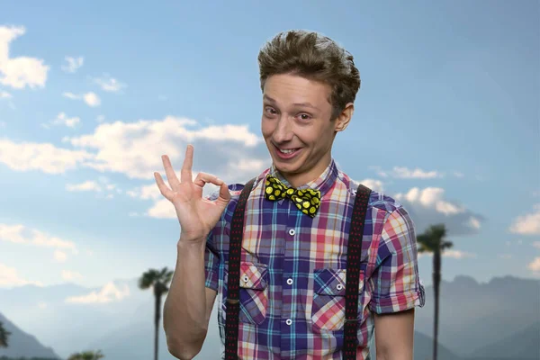 Cute happy teenage boy showing ok sign. — Stock Photo, Image