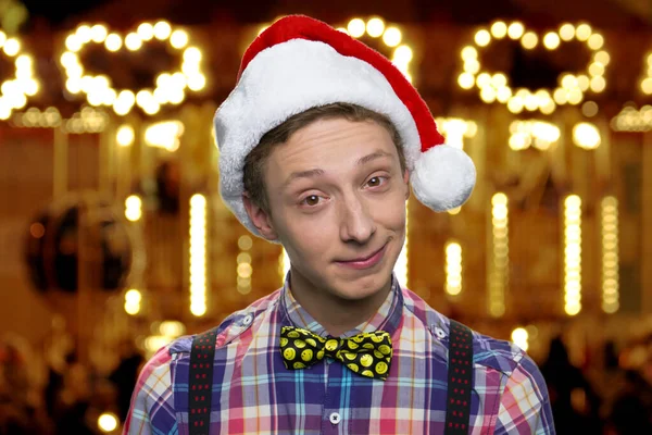 Close up teen boy in Christmas hat. — Stock Photo, Image