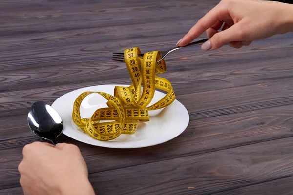 Measure tape instead of food. — Stock Photo, Image