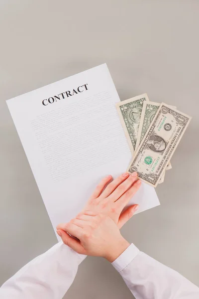 Top view of female hands, contract and money. — Stock Photo, Image