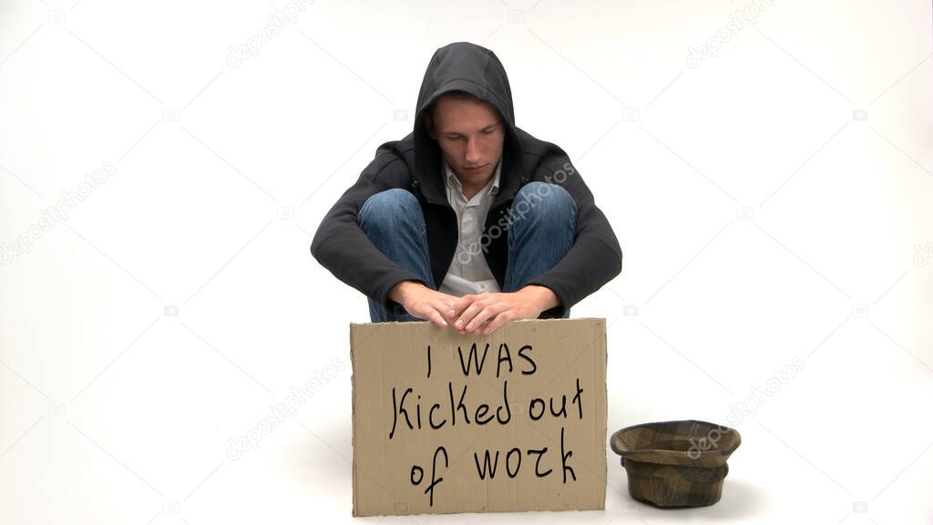 Sad young man was kicked out of work.