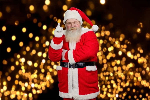 Weihnachtsmann hob Zeigefinger. — Stockfoto