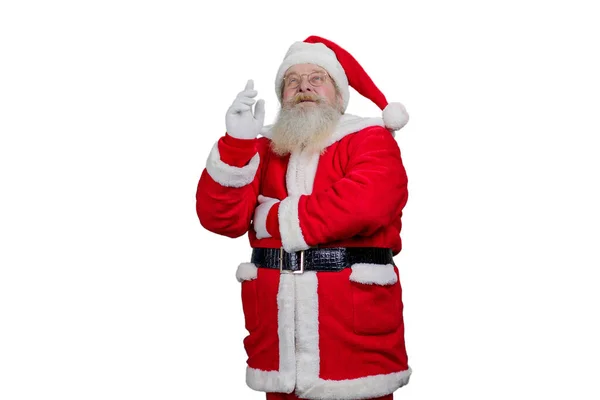 Papai Noel apontando para cima, fundo branco. — Fotografia de Stock