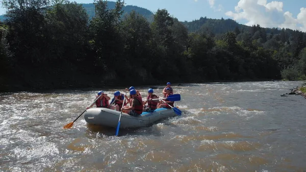 The inflatable boat on a fast stream of water.