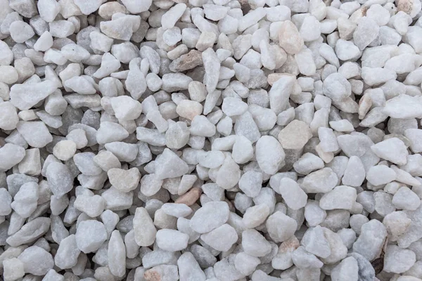 White pebbles, marble . White landscape marble chips texture.