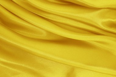 Altın sarısı kumaş dokusu arka plan, ipek ya da keten desenlerin ayrıntıları.