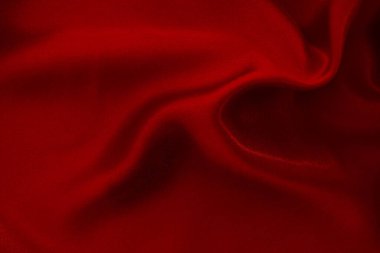 Koyu kırmızı kumaş dokusu arka plan, ipeğin veya keten deseninin ayrıntıları.