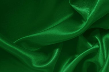 Yeşil zümrüt kumaş dokusu arkaplan, ipeğin veya keten deseninin ayrıntıları.