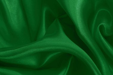 Yeşil zümrüt kumaş dokusu arkaplan, ipeğin veya keten deseninin ayrıntıları.