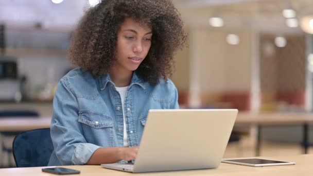 Excited African Woman Celebrating Success on Laptop at Work — Stock Video