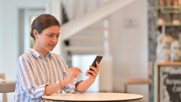 Disappointed Young Indian Woman having Loss on Smartphone — Stock Video