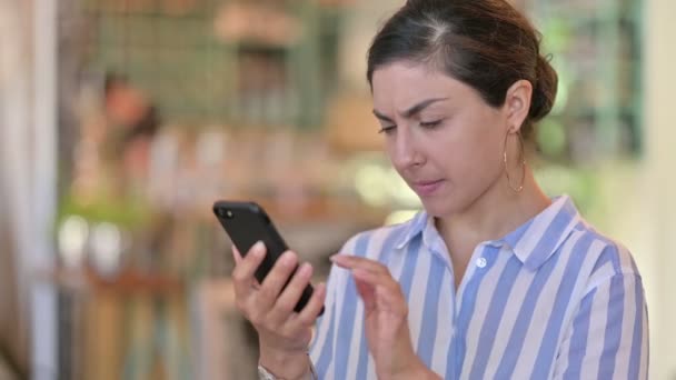 Portrait of Disappointed Young Indian Woman having Loss on Smartphone — Stock Video