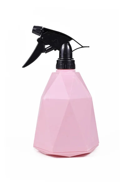Pink water mist spray bottle for cleaning or spraying plants on white background