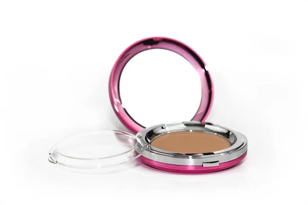 Pressed facial powder in bright pink case with mirror isolated on white background