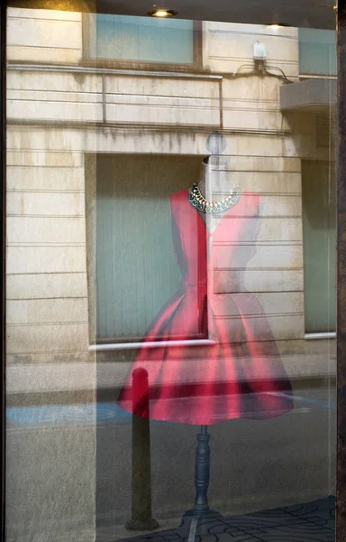 Red dress at fashion shop exhibition window