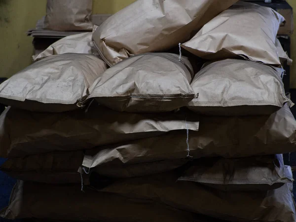 Full brown kraft paper bags with charcoal, at a coals plant