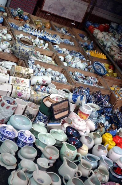 Panjiayuan antique market in Beijing china - Decorated pottery on Beijing its biggest and best-known arts crafts and antiques market Chinese name is Panjiayuan with over 4000 shops and nearly 10000 dealers