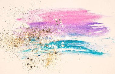 Altın glitter ve vintage nostaljik renklerde soyut suluboya sıçrama üzerinde parlak yıldız.