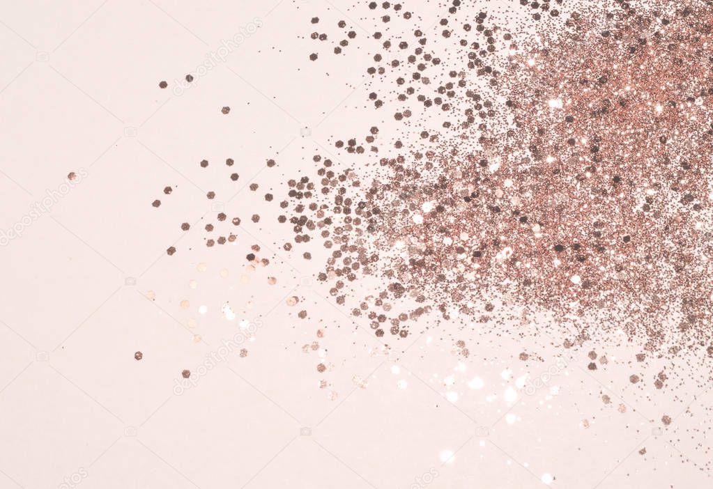 Rose gold glitter on white background in vintage nostalgic colors