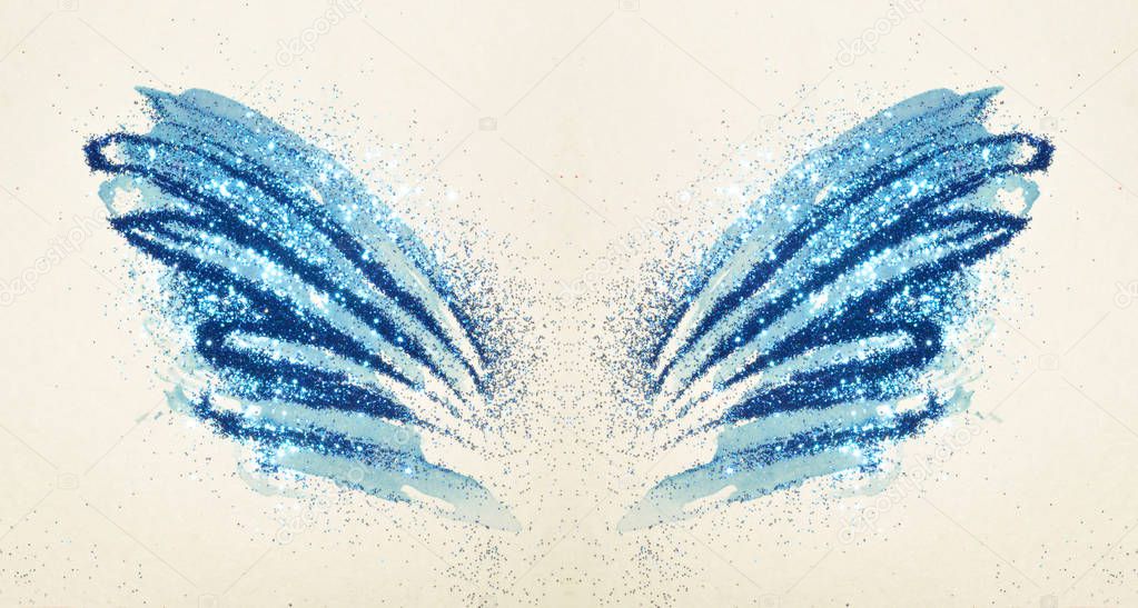Blue glitter on abstract blue watercolor wings in vintage nostalgic colors.