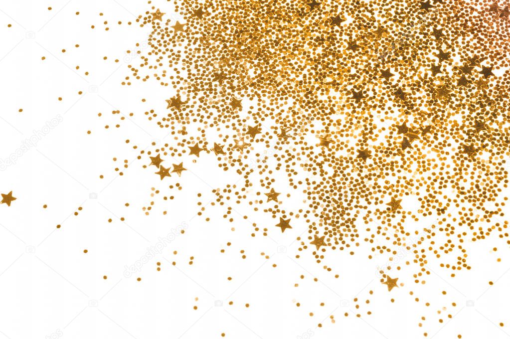 Golden glitter and glittering stars on white background