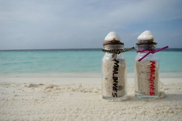 Maldives Ocean Writing Red Black Botlles Royalty Free Stock Fotografie