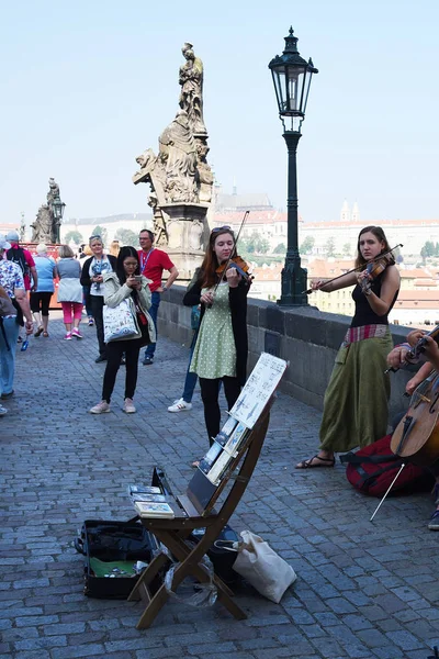 stock image Prague, Czech Republic, May 12, 2018 - Tourists walk along the Charles Bridge on a sunny spring day.