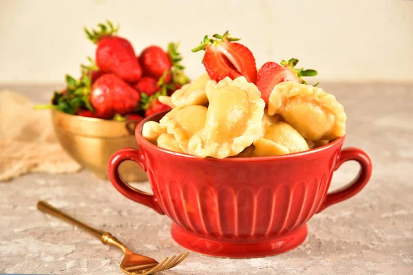 Pierogi. Dumplings with with strawberry . Ready meal.