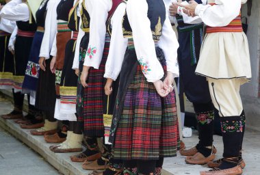 Dancers wearing one of the traditional folk costume from Uzide, Serbia