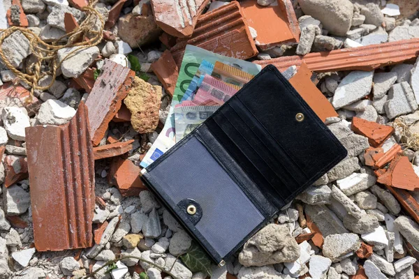 Lost Wallet with money on construction waste, tossed, banknotes, euros.