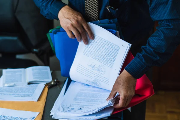 lawyer, office worker searching a document and reading important documents for his job.