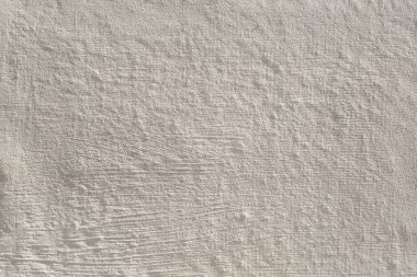 Beige painted grunge concrete wall texture. Abstract background.