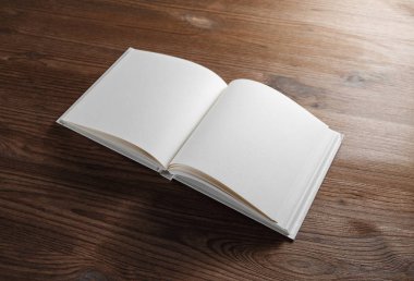 Boş açık kitap veya ahşap masa arka plan üstünde defter. Duyarlı tasarım mockup.