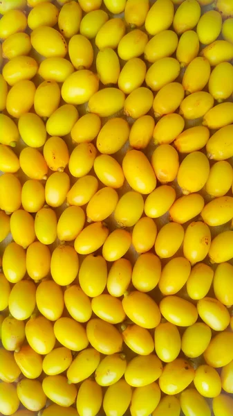 Yellow Neem Fruits Full Screen Texture — стоковое фото