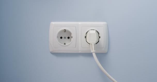 Hand Plugging Green Power Cord Wall Socket Concept Eco Green — Stock Video