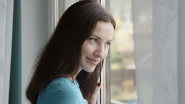 Portrait Smiling Female Standing Window Shot Red — Stock Video